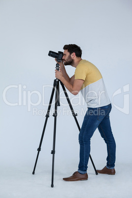 Photographer clicking picture using digital camera