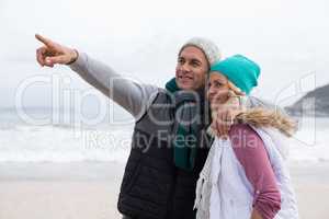 Mature couple embracing each other on the beach