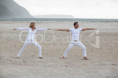 Mature couple doing stretching exercise