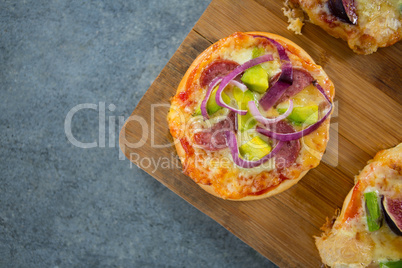 Pizza arranged on a wooden tray
