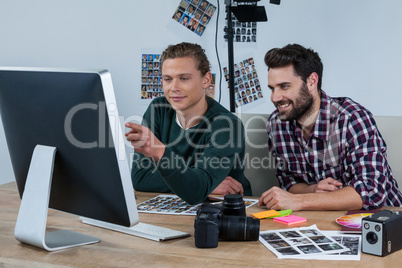 Photographers working at desk