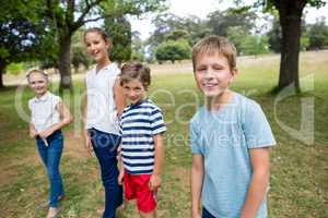 Kids standing together in park