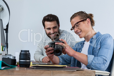 Photographers working together at the desk