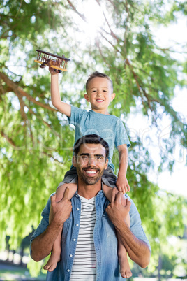 Father having fun with his son in park