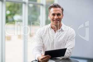 Businessman holding digital tablet