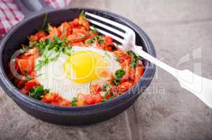 Traditional Middle Eastern dish of Shakshuka in a pan.