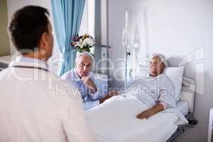 Senior patient interacting with doctor