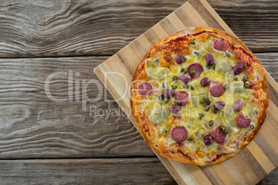 Italian pizza served in a chopping board