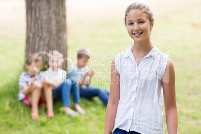 Smiling girl standing in park