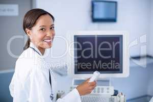 Portrait of doctor using ultrasound machine