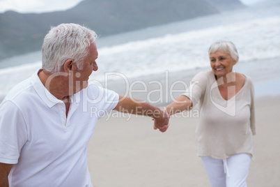 Senior couple having fun together at beach