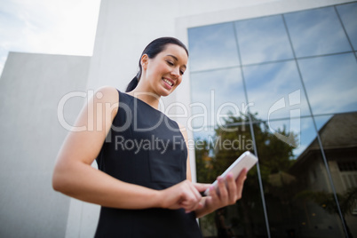 Businesswoman using mobile phone