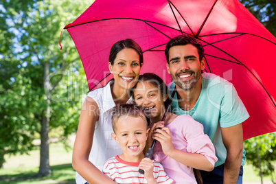 Portrait of happy family enjoying time together in the park