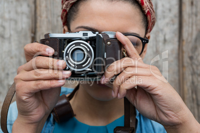 Female photographer with old fashioned camera