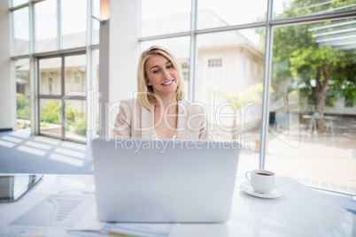 Businesswoman using laptop