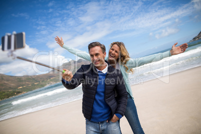 Mature couple taking selfie with selfie stick