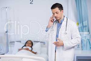 Doctor talking on mobile phone