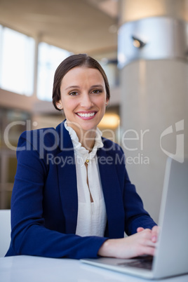 Businesswoman using laptop