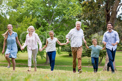 Multi-generation family enjoying together in park