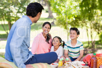 Happy family enjoying together in park