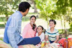 Happy family enjoying together in park