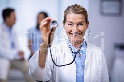 Portrait of female doctor holding stethoscope