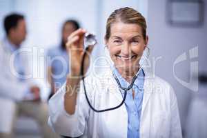 Portrait of female doctor holding stethoscope