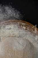 Bread dough ball on a wooden tray