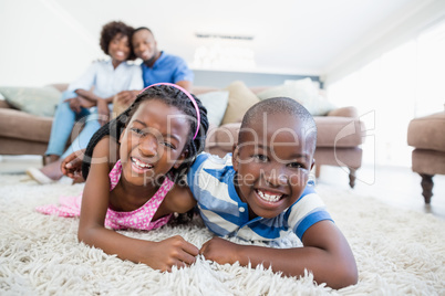 Siblings playing in living room