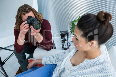 Female model posing for photographer