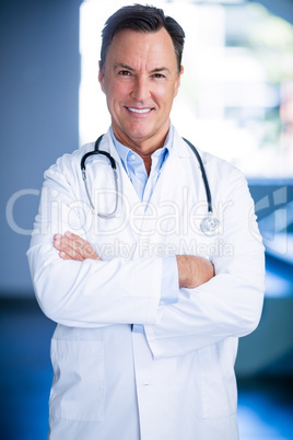 Portrait of doctors standing with arms crossed