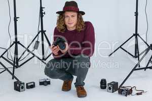 Photographer holding digital camera