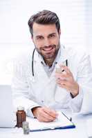 Portrait of doctor checking medicine