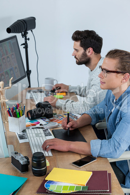 Photographers working together at the desk