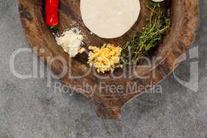 Spices and vegetable with pizza dough