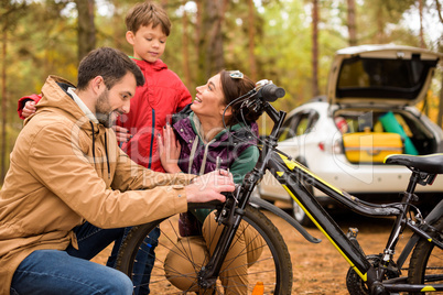 Happy family with bicycle