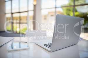 Laptop and digital tablet on table