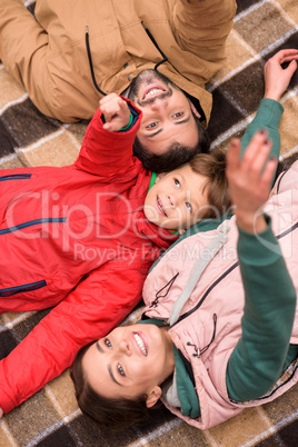 Happy family on checkered plaid