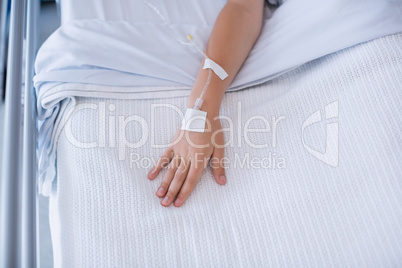 Boy patient hand injected with saline iv drip