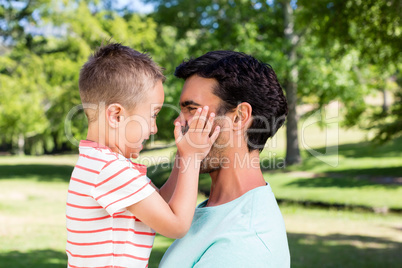 Father and son enjoying together in park