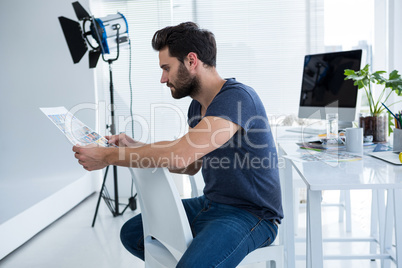 Photographer looking at the photographs