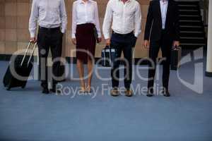 Business executives standing in a conference center lobby