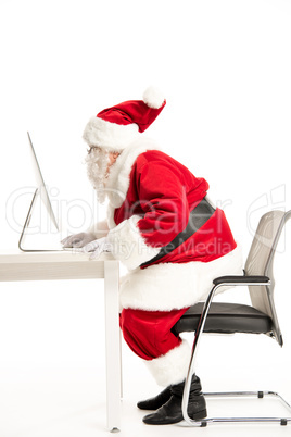 Santa Claus using computer