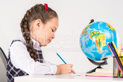 Schoolgirl writing homework