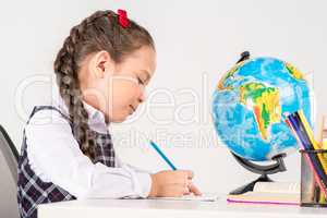 Schoolgirl writing homework