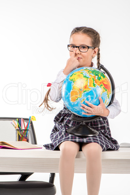Schoolgirl holding globe