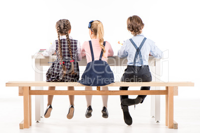 Schoolchildren studying at desk