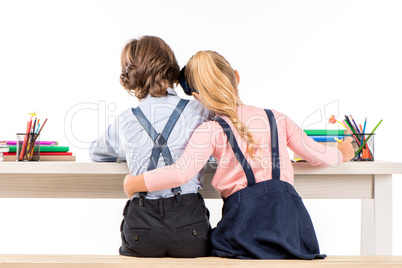 Classmates sitting at desk