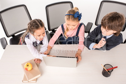 Classmates using laptop