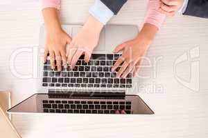 Classmates  using laptop